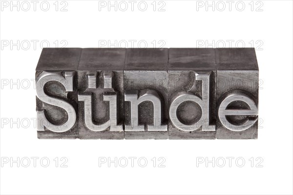 Old lead letters forming the word 'Suende'
