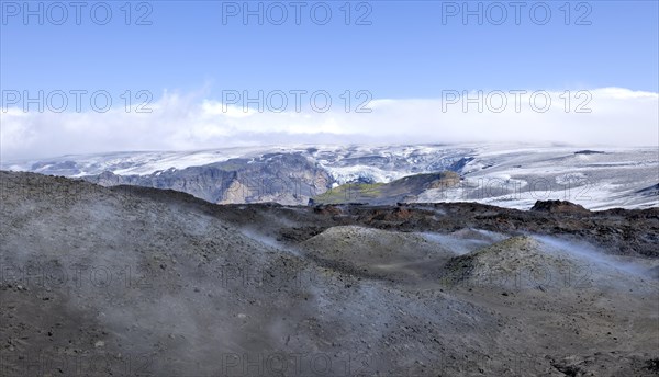 View across new lava fields created by a volcanic eruption in 2010 to the Myrdalsjokull glacier