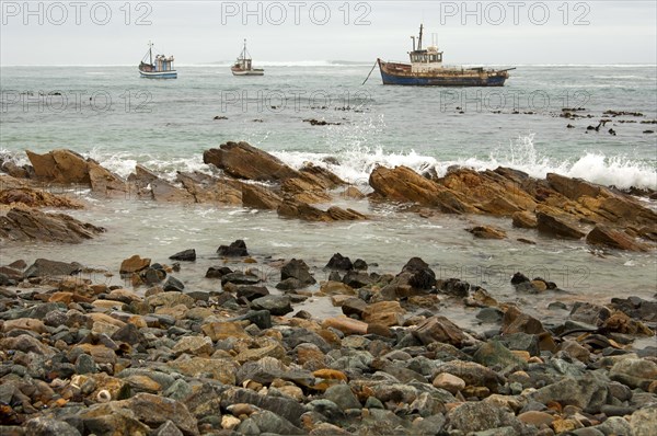 Fishing boats in bad weather at sea off the coast of Port Nolloth