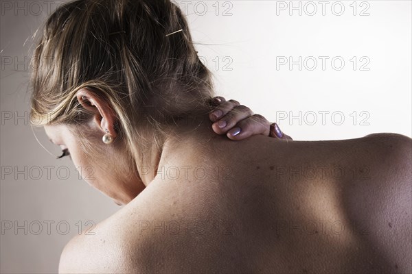 Young woman with neck pain