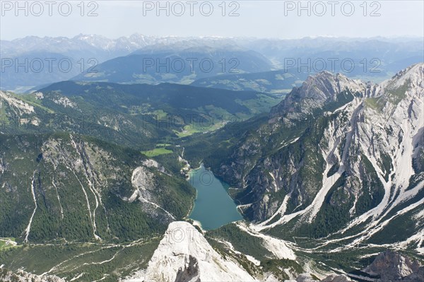 Panoramic view of the Alps from the peak of Mt Seekofel towards the north with Pragser Wildsee Lake