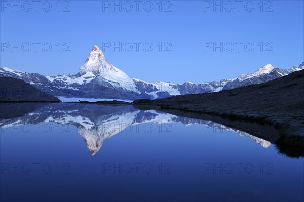 Mt Matterhorn reflected in Stellisee Lake at dusk