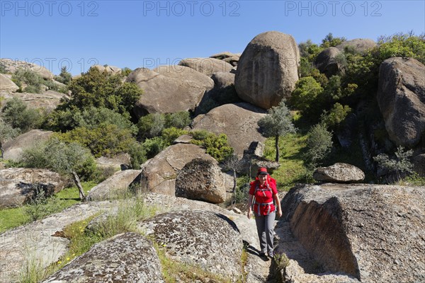 Woman wearing a backpack while hiking in the Latmos Mountains