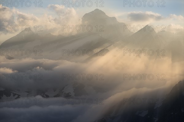 Clouds at the Furka Pass with mountains Finstaarhorn