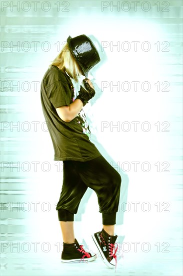 Girl posing with a hat