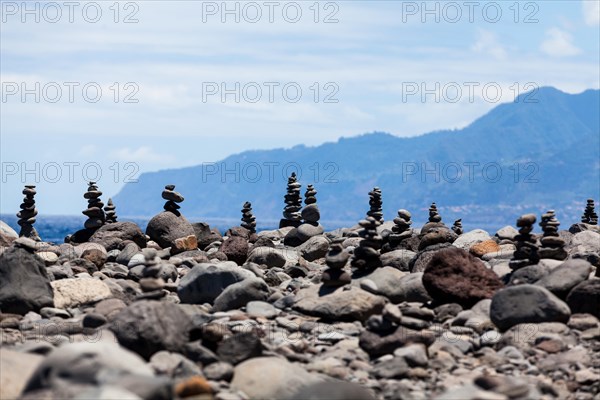 Cairns built as good luck charms at the Ilheus da Rib rock formation