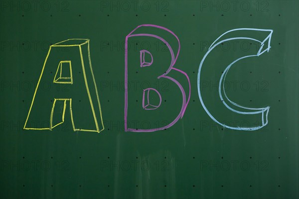 ABC' written with chalk on a blackboard