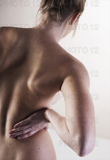 Bare back of a young woman