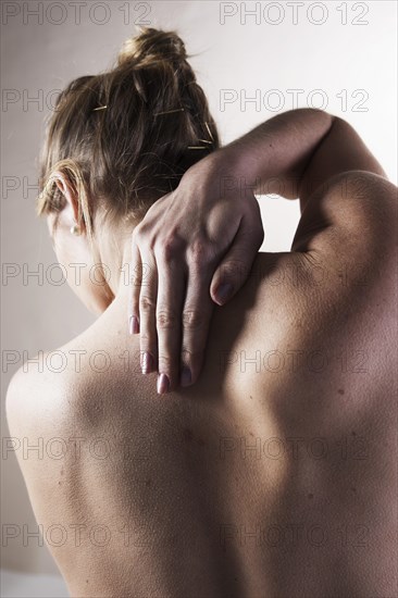 Young woman with neck pain