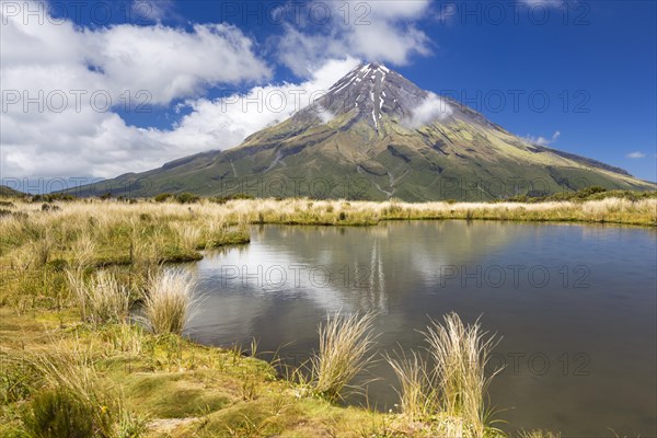 Mountain lake with the Mount Taranaki volcano