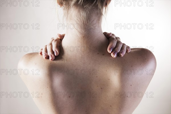 Bare shoulders of a young woman