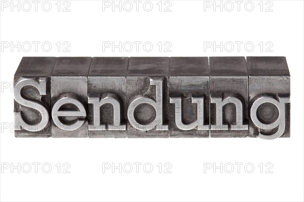 Old lead letters forming the word 'Sendung'