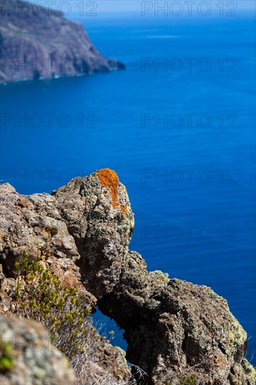 Cliff coast near Ponta do Pargo with lichen growing on the rocks