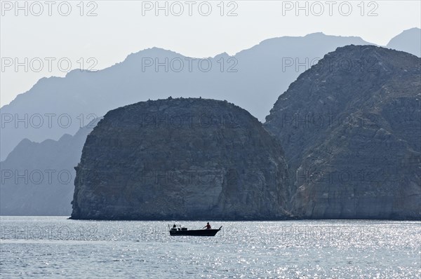 Khor Ash Sham Fjord with a fishing boat