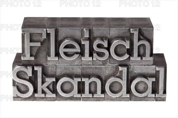Old lead letters forming the term 'Fleischskandal'