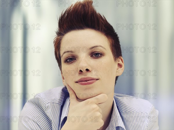 Young woman with her head propped up