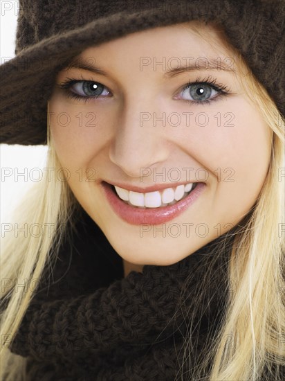 Young woman wearing a brown hat