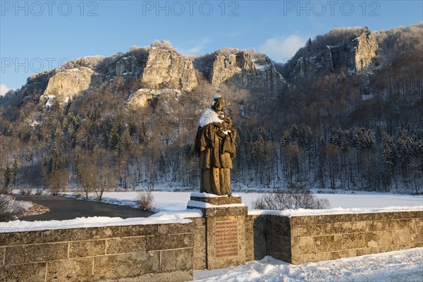 Hausener Bridge with the statue of St. Nepomuk in front of the Hausener Zinnen rocks in the evening light