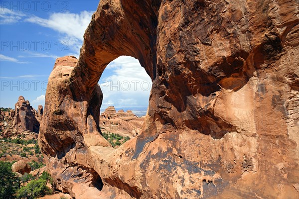 Sandstone arches of the Double O Arch formed by erosion in Devil's Garden