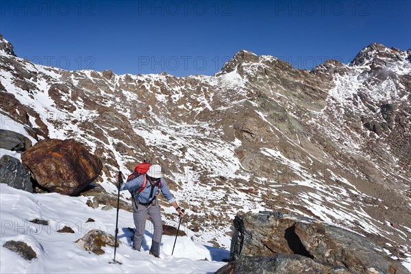 Hiker during the ascent of Hintere Eggenspitze Mountain in the Ulten Valley