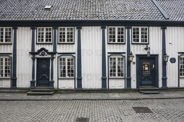 White wooden house with a Rococo facade