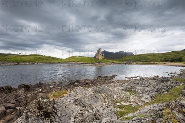 Ruins of Ardvreck Castle on a peninsula in the lake of Loch Assynt