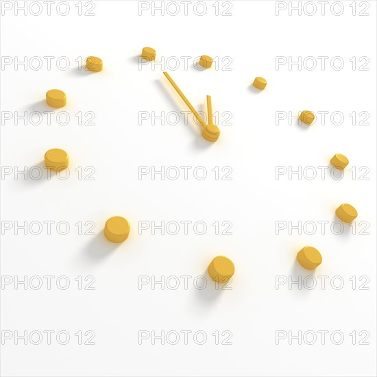 Yellow dial and hands of a clock