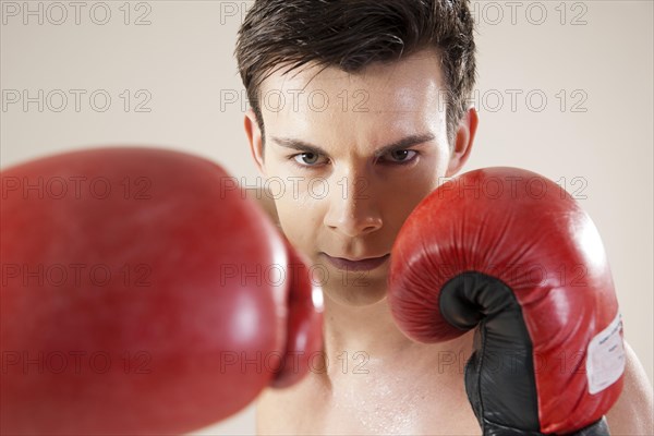 Young man during boxing training