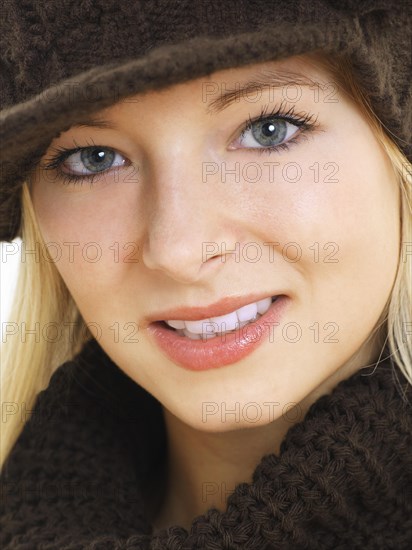 Young woman wearing a brown hat