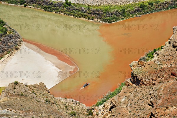 Confluence of Green River and the Colorado River in the Needles district with a boat