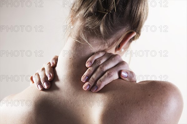 Young woman with neck pain