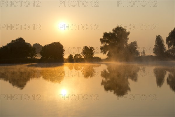 Sunrise over a pond landscape