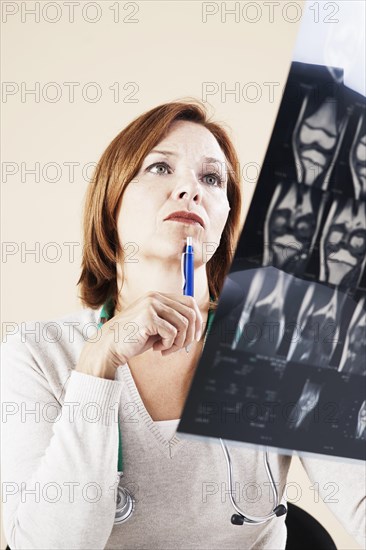 Female doctor looking at an X-ray