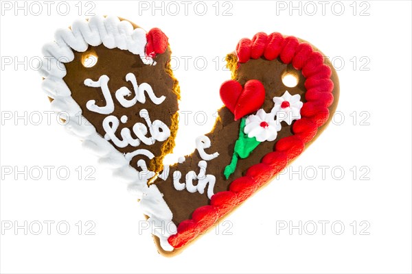 Broken gingerbread heart with the message 'Ich liebe Dich'