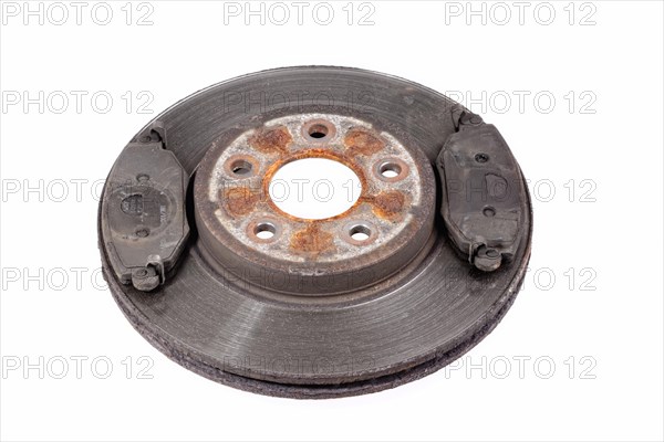 Worn brake disc with grooves from the brake pad