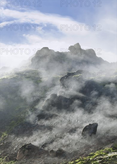 Steam rising from a lava field at the foot of Brennisteinsalda Volcano