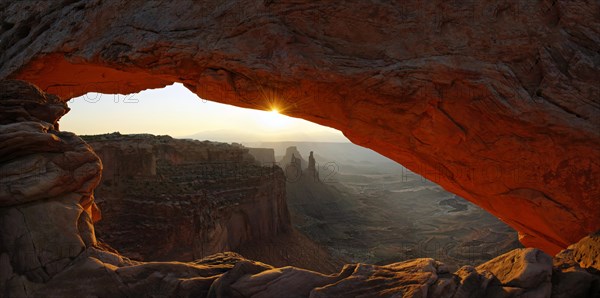 Sunrise at Mesa Arch stone arch