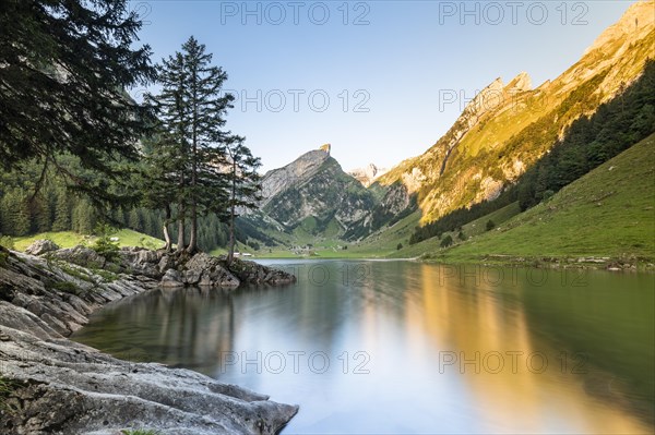 Mountains reflected at sunrise in Lake Seealpsee