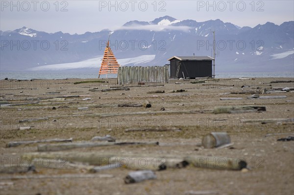 Old trapper cabin with a modern weather station