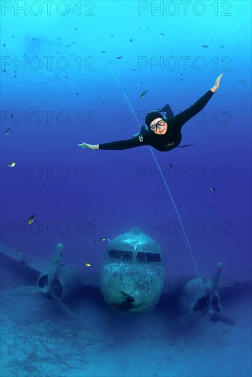 Freediver at plane wreck Douglas Dakota