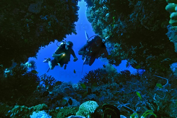 Scuba divers in a cave