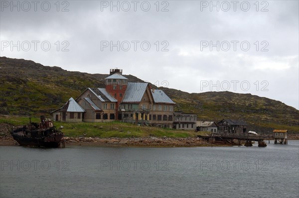 Derelict houses of a rural locality on the Barents Sea