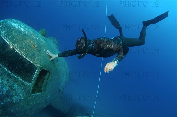 Freediver at the plane wreck Douglas 'Dakota'