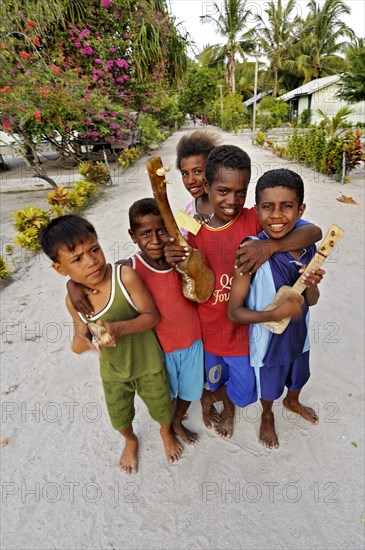 Children with ukulele toys