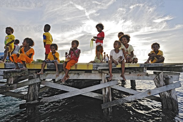 Children on a jetty