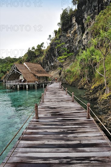 Wooden pier and water bungalows in a holiday resort