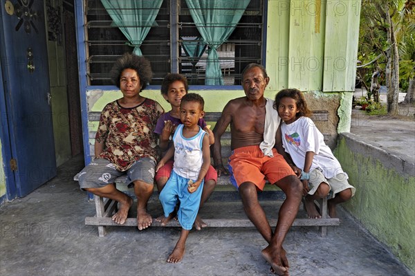 Family sitting on a bench