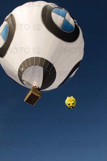 Two hot air balloons up in the sky