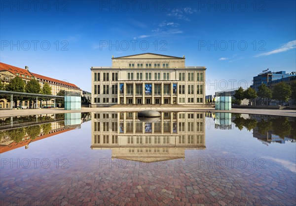 Opera Leipzig with reflection in the water of the Opernbrunnen