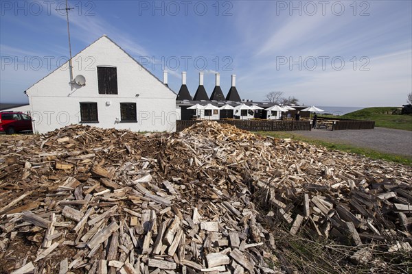 Smokehouse with firewood needed for smoking